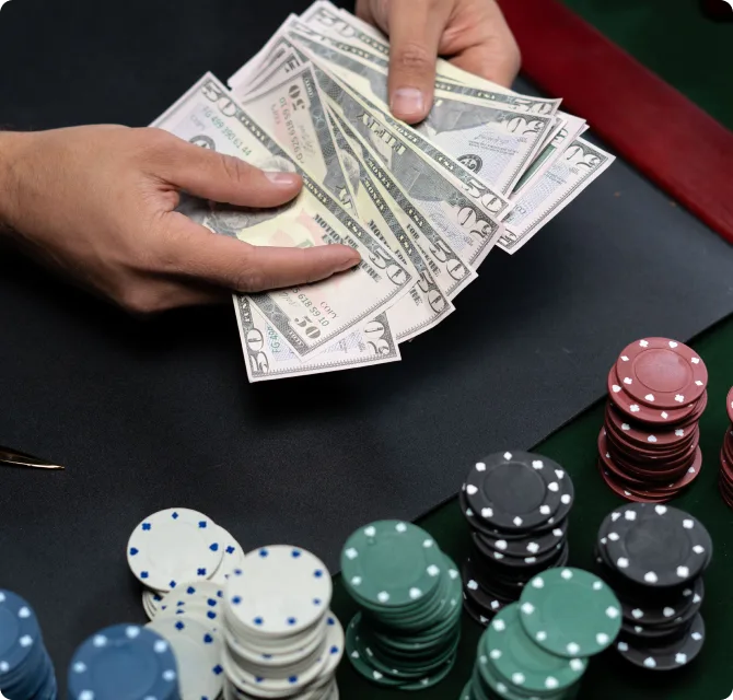 Hands holding casino chips